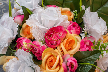 Alliances in bouquet of flowers