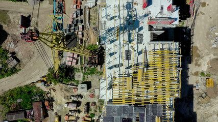 Aerial view of high residential apartment building under construction. Real estate development