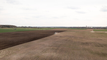 Partly Plowed Farm field in the Spring farming Season