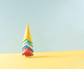 Colored ice cream cones against the wall. Bright summer minimum concept idea