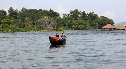 Fototapeta na wymiar Boat tour in river. Nile River at its source in Uganda. Jinja - Uganda.