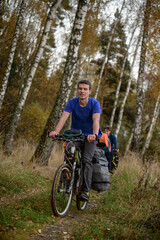 Fototapeta premium Bicyclist in the forest, Russia