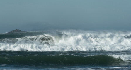 Fototapeta premium Dramatic storm surf near Westport Jetty