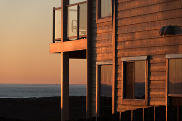 Sunset puts glowing highlights on walls of a resort building