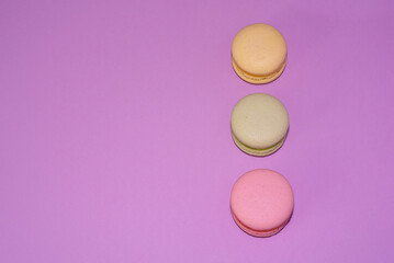 Macaroni with sweet almonds or dessert cake made of almond cookies, painted in the fashionable color of 2022. Very beautiful background.