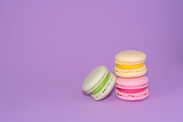 Macaroni with sweet almonds or dessert cake made of almond cookies, painted in the fashionable color of 2022. Very beautiful background.