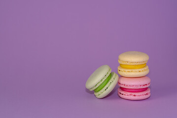 Macaroni with sweet almonds or dessert cake made of almond cookies, painted in the fashionable color of 2022. Very beautiful background.