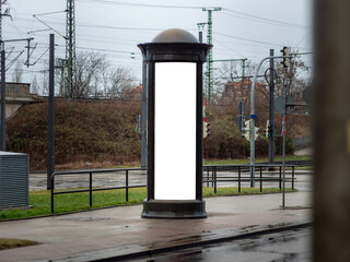 Advertising pillar in the city. Blank mockup for testing ad designs on the column next to the...