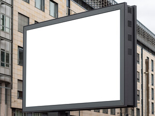 Blank billboard mockup as copy space for testing advertisements. Empty white screen to display banner ads. Template for a promotion campaign in an urban area with building facades in the background.