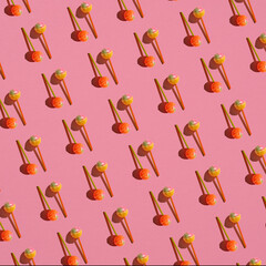 Colorful Set of Lollipops. pattern made with caramel on a stick on bright pink background.  creative pattern.  lot of lollipops chupa chups...