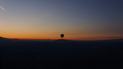 Silhouette of a hot air balloon on the sunrise, Cappadocia, Turkey