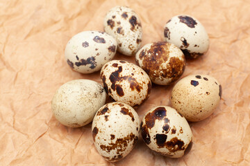 quail eggs arranged on brown paper background