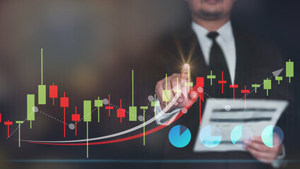 Businessman use laptop ,analytics and financial and bank technology concept, chart from computer laptop,Business growth concept. business finance technology and investment concept. Stock Market.. 