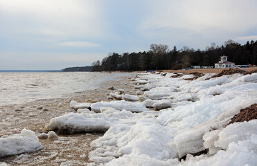 The frozen coast of the Gulf of Finland with a bizarre form of ice. Zelenogorsk, Russia, spring season, ice breaking period