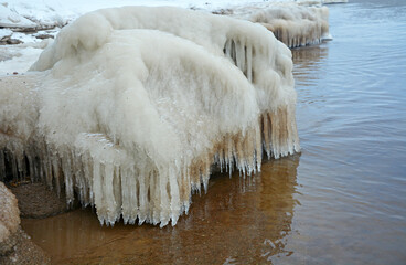 The frozen coast of the Gulf of Finland with a bizarre form of ice. Zelenogorsk, Russia, spring season, ice breaking period