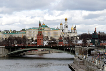 view of the moscow kremlin, the moscow river and the big stone bridge in cloudy weather