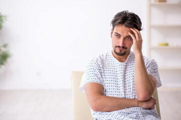 Young male patient waiting for doctor at the hospital