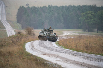 British army Spartan FV103 tracked armoured reconnaissance vehicle in action on a military exercise...