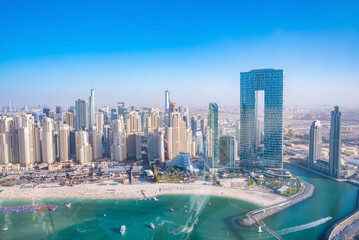 Obraz premium Aerial view of the Dubai Marina and JBR area from the famous Ferris Wheel and golden sand beaches in the Persian Gulf. Holidays and vacations in the UAE
