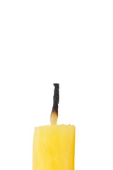 The extinguished stub of the wax candle.