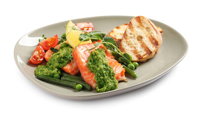 Tasty cooked salmon with pesto sauce and fresh salad on white background