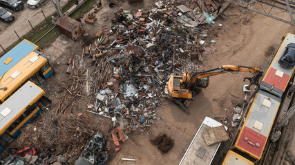 Trash Metal Scarp Yard with excavator making recycling process - obrazy, fototapety, plakaty