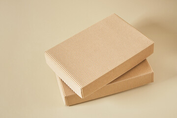 corrugated boxes on a beige background, mock-up packaging for products, delivery boxes, eco-friendly