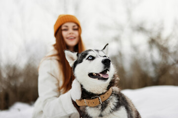 woman with a purebred dog winter landscape walk friendship fresh air