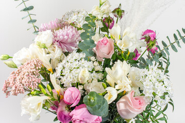 Bouquet of pastel colored flovers on white background.