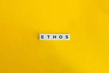 Ethos Word on Letter Tiles on Yellow Background. Minimal Aesthetics.