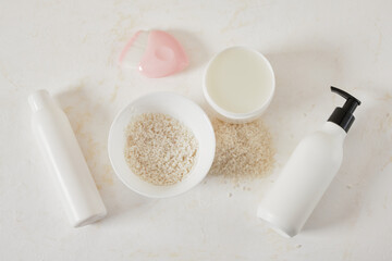mockup white bottles of cosmetics, rice and water bowls, fermented skin and hair care products, organic cosmetics