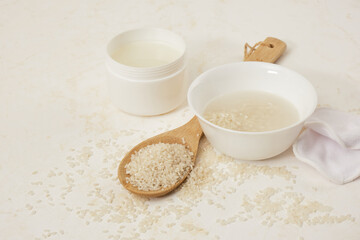 white bowls with rice and rice water, fermented skin and hair care products, organic cosmetics, light background