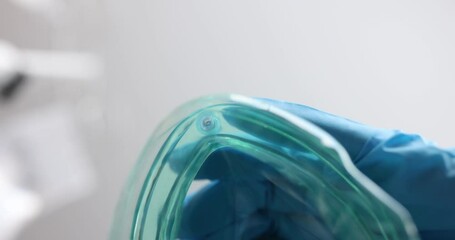 Doctor applying ambu bag to patient face for emergency care closeup 4k movie slow motion