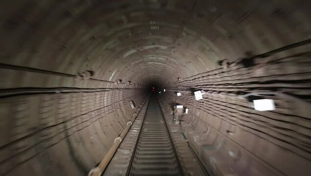 View along the subway tunnel from train driver cabin