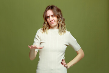 Frowning dissatisfied young woman showing so-so gesture. Questionable choice. Unsuitable options...