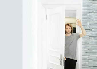 Fototapeta na wymiar man opening the door of his home.