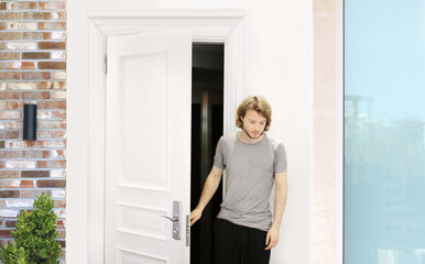 Fototapeta na wymiar man opening the door of his home.