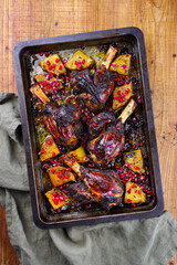 Traditional braised slow cooked Australian lamb shank with pineapple and pomegranate served as top...