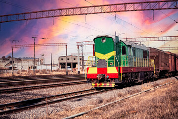 Fototapeta na wymiar Diesel locomotive railway on a background of blue sky with white clouds