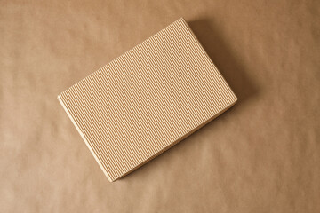 mockup blank corrugated cardboard box on brown background