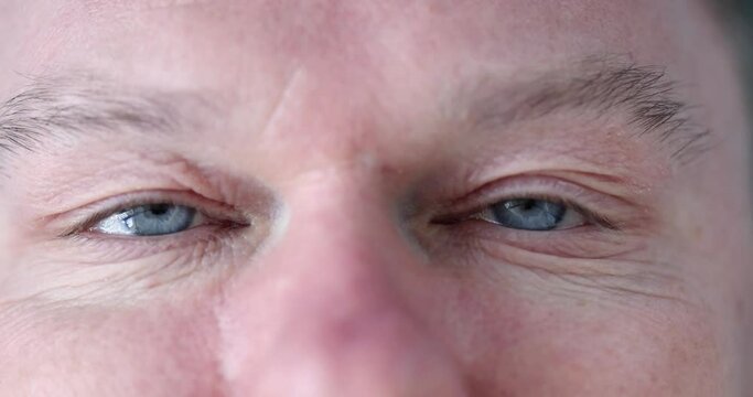 Closeup of male eyes with horizontal nystagmus 4k movie