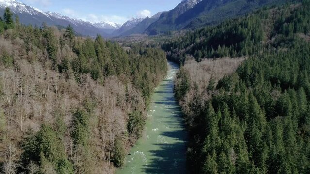 Amazing Mountain Reveal Shot by Drone Flying Over River in Pacific Northwest
