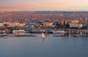 Panorama of Aswan city along Nile river with felucca boats in Egypt, Africa