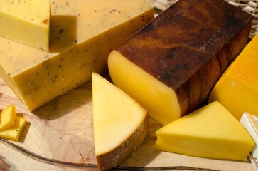 types of cheese on wooden table