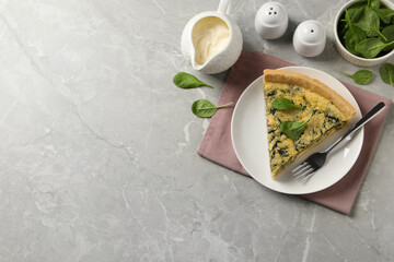 Piece of delicious spinach pie served on light marble table, flat lay. space for text