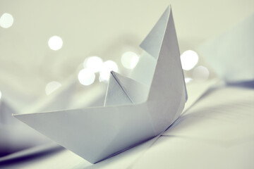 business concept - paper boats on the documents