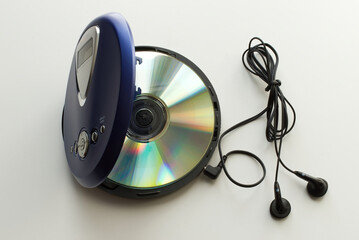 Vintage CD Player with headphones on white background. Vintage Technology from the 90s.