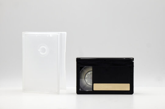 Vintage Mini DV video tape cassette with cassette box on white background. Retro style technology from the 90s