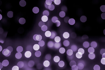 background blurred abstraction of colored lanterns and decorations. bokeh texture of street colored lights