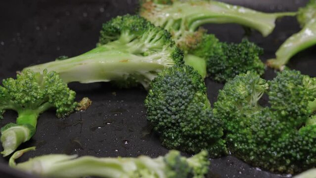 frying broccoli on oil fry pan 4k